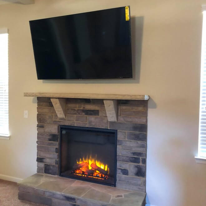 70 inch TV above a fireplace in Sandy Springs, GA