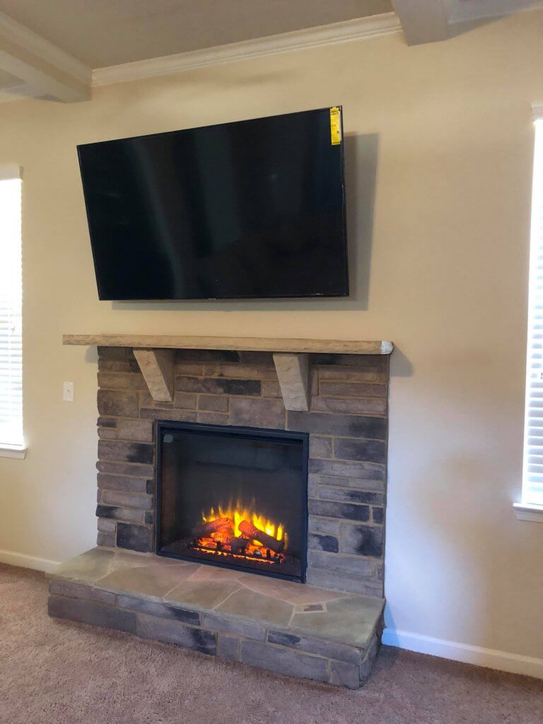 70 inch TV above a fireplace in Sandy Springs, GA